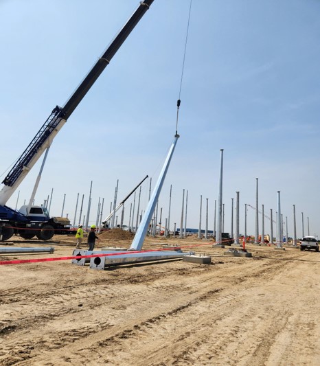 Crews perform the 500 kV steel lift.